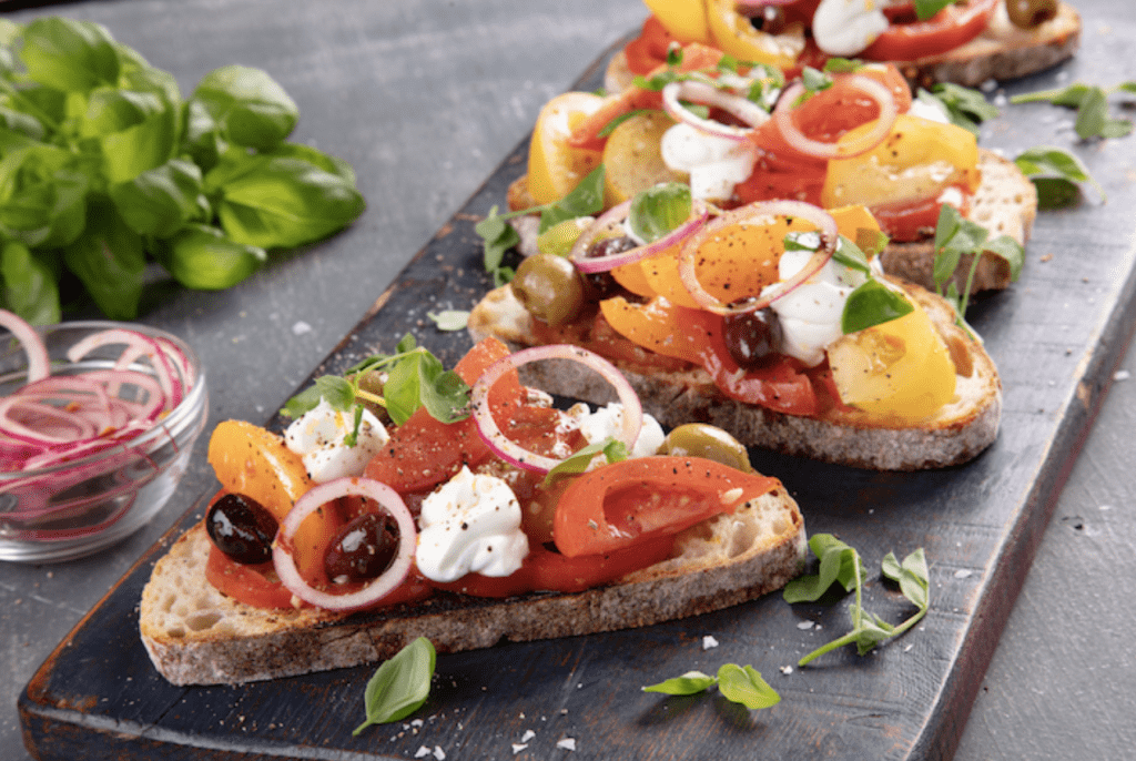 Heritage Tomato Salad Topped Sourdough - Whipped Goats Cheese And Pickled Pink Onions - Oliver Kay